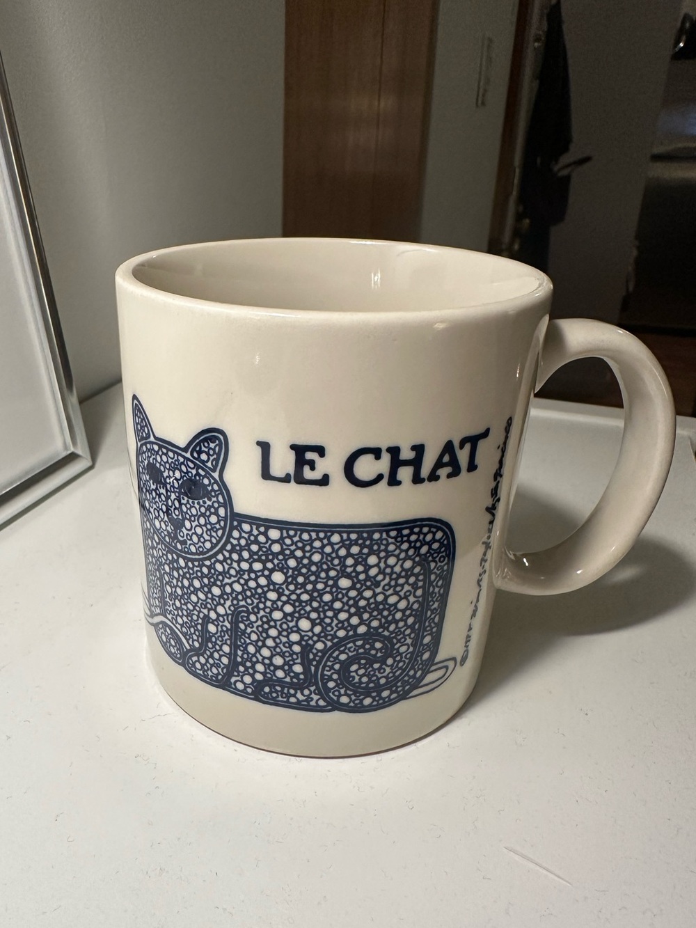 Le Chat White Ceramic Mug with Blue Cat Design